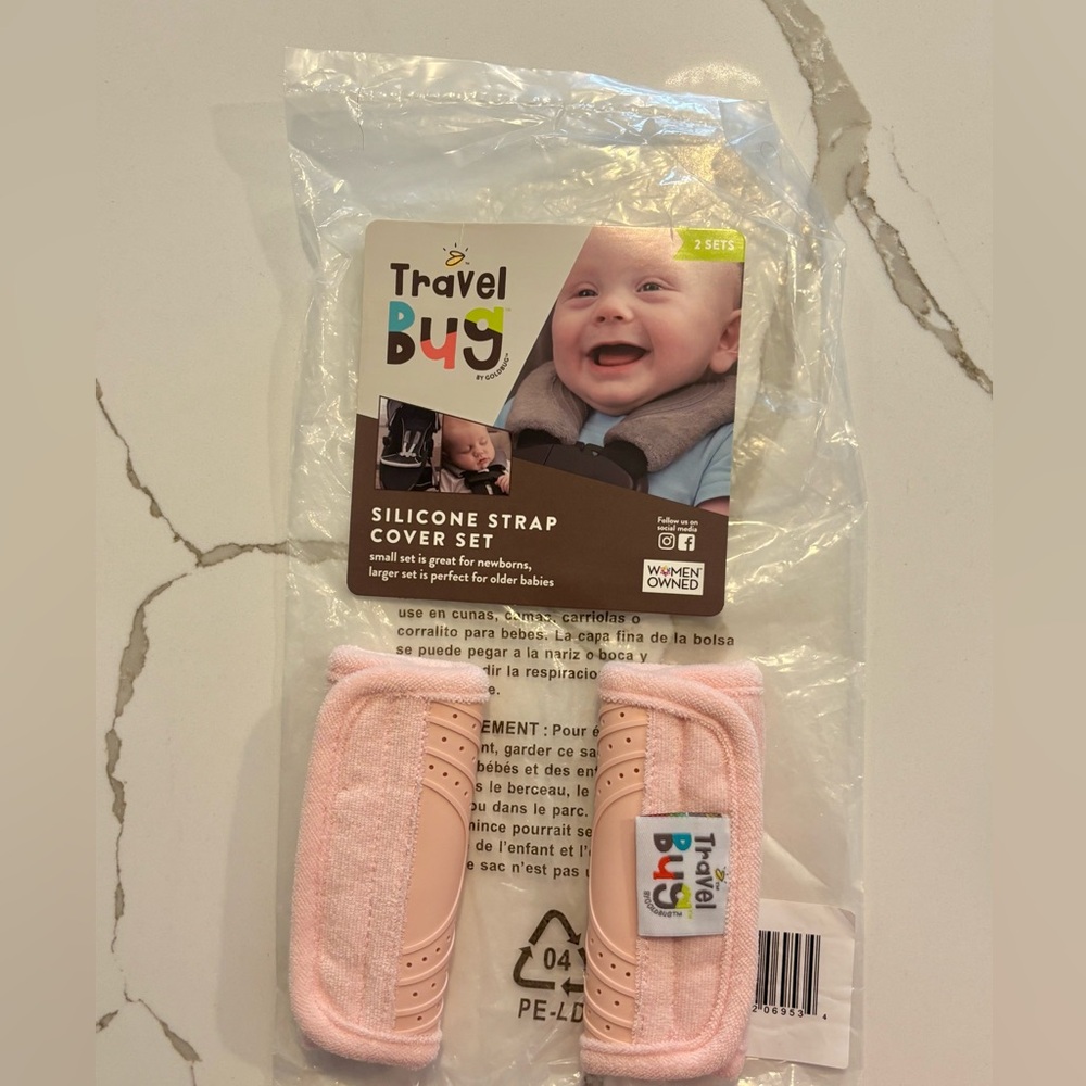 NWOT. Travel bug. Large pink silicone seatbelt covers for car seat.
